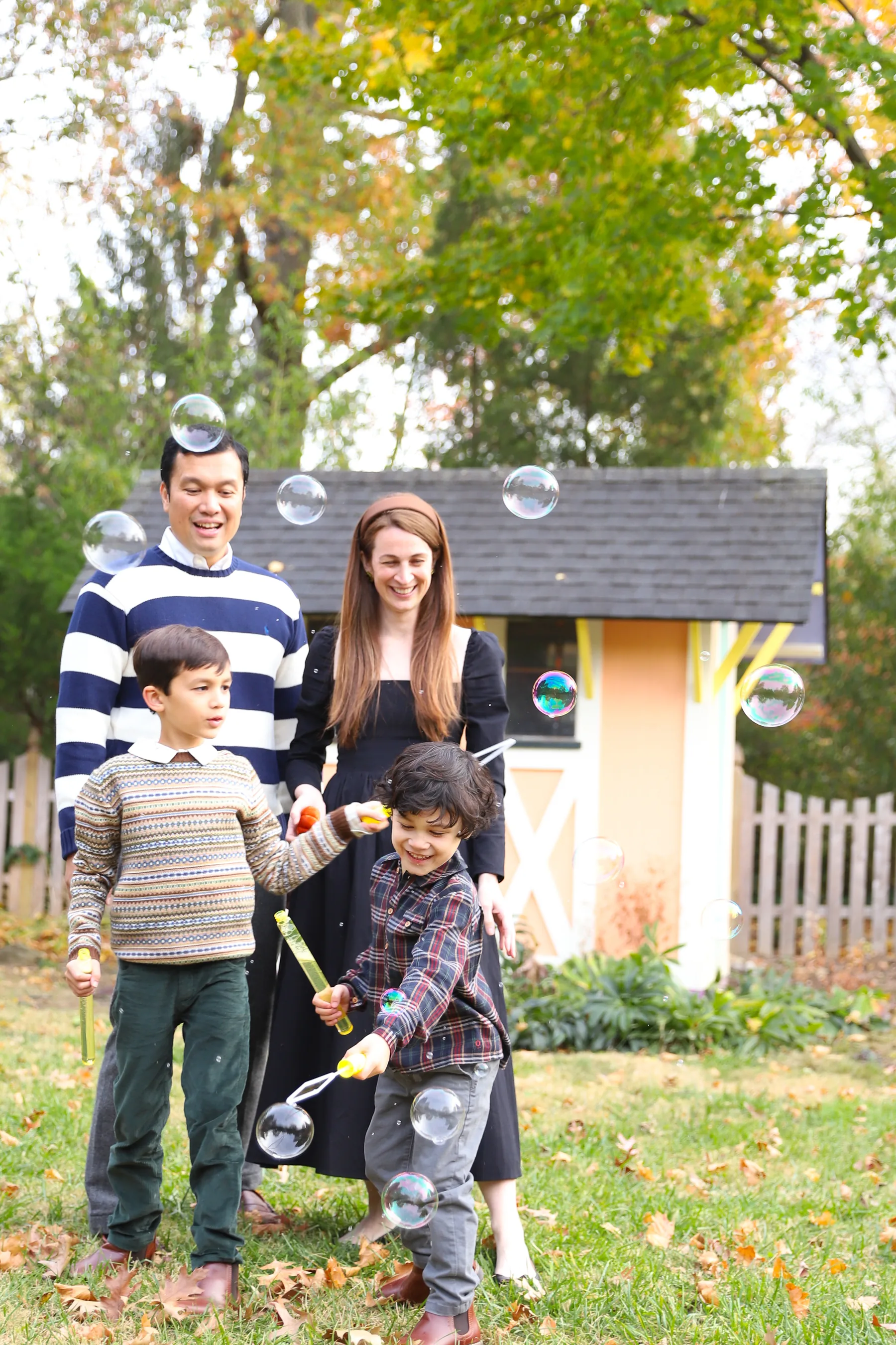A family enjoying a playful outdoor portrait session